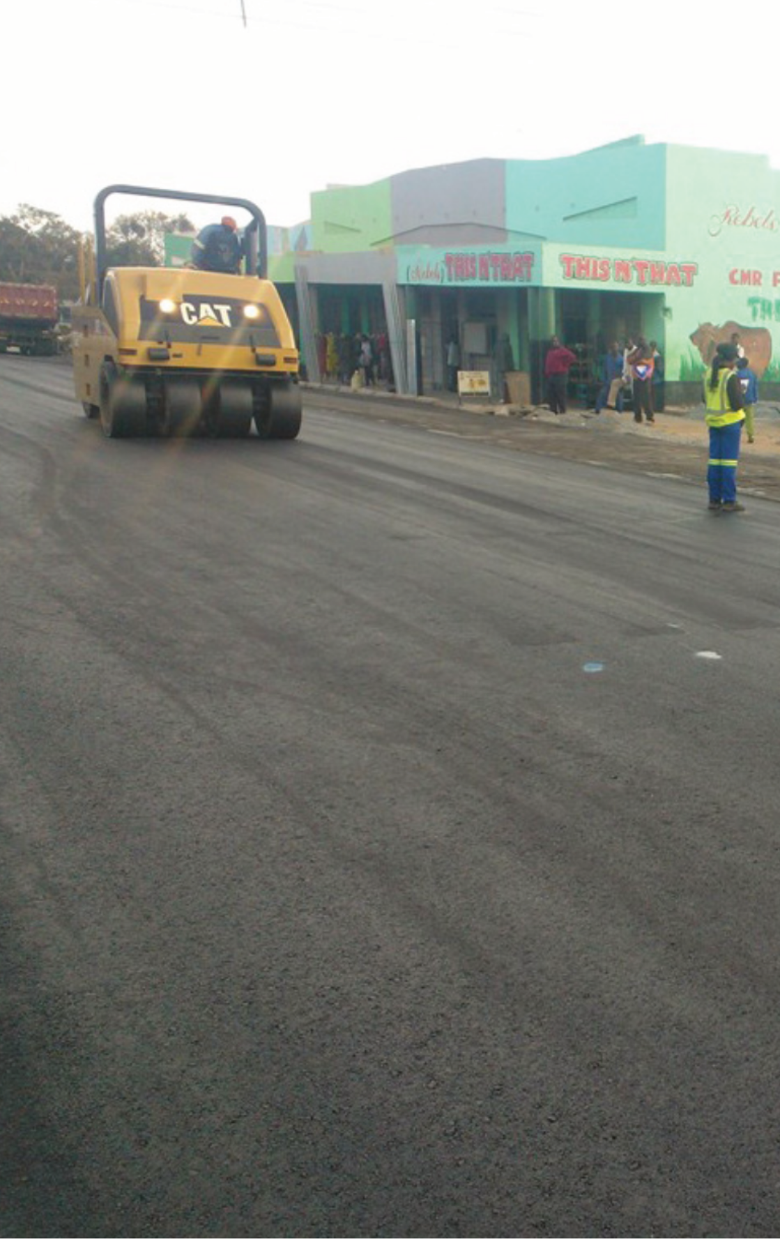 CAT road roller compacting asphalt